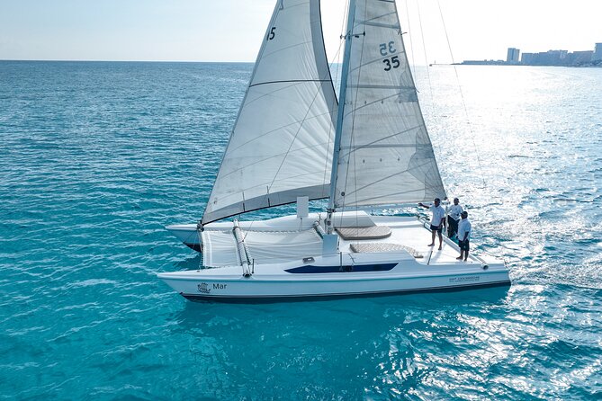 All-Inclusive Isla Mujeres Catamaran with Free Transportation - Boarding with a mimosa and open bar