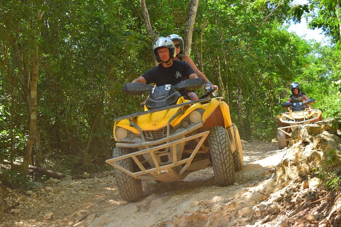 ATV Single & Zip Line from Cancun - Entering a clear-water cenote