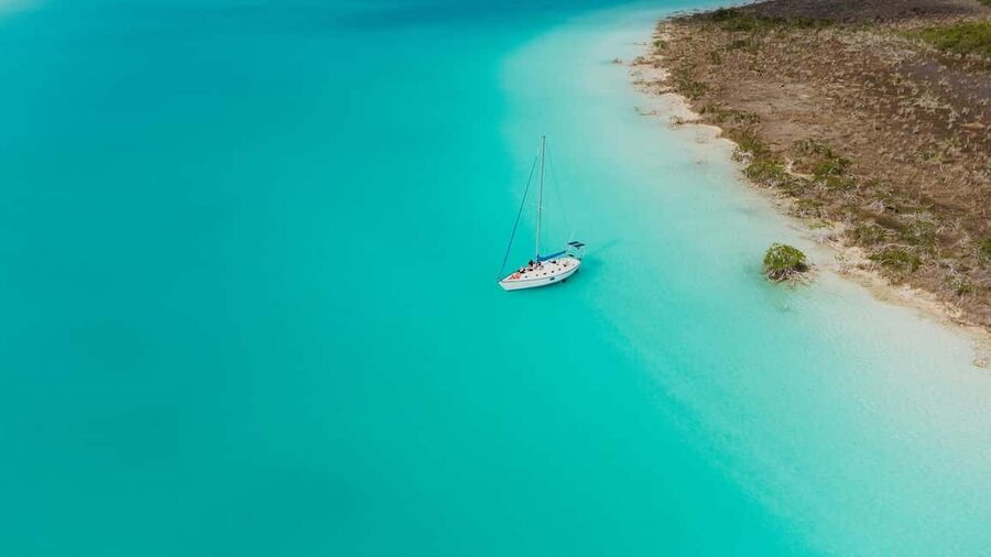 Bacalar Lagoon Sailing Tour with Open Bar and Mexican Lunch - Cenotes, clear water, and swimming time