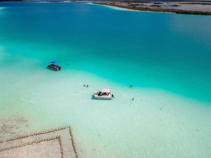 Bacalar: Lake of Seven Colors Pontoon Tour with Fruit - Swimming in clear, shallow water