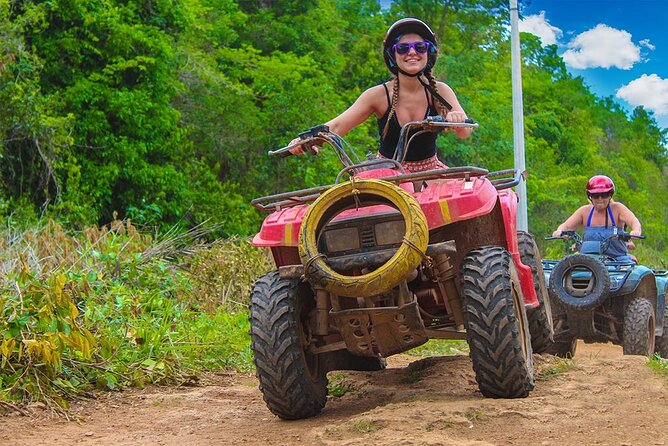 Cancun Combo Tour: ATV and Zip- lines with Cenote Swim - ATV riding on a rough, dusty track