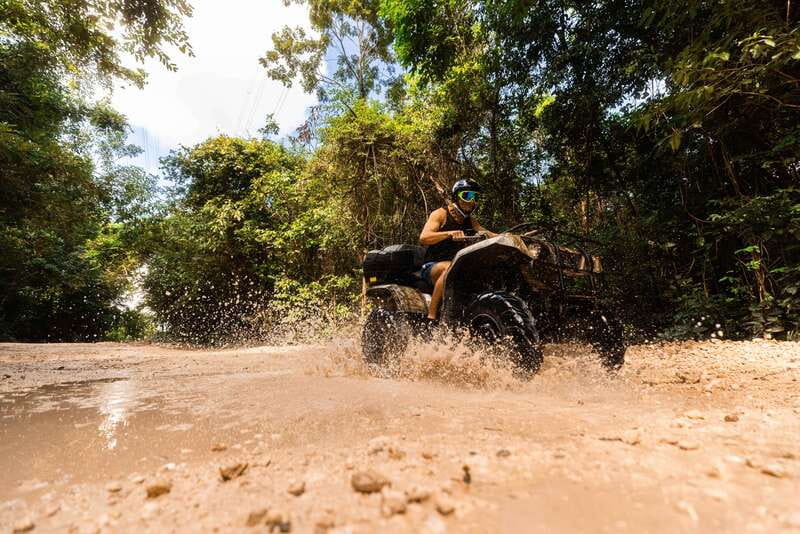 Cancun: Jungle ATV Tour, Ziplining, and Cenote Swim - Three ziplines through the trees