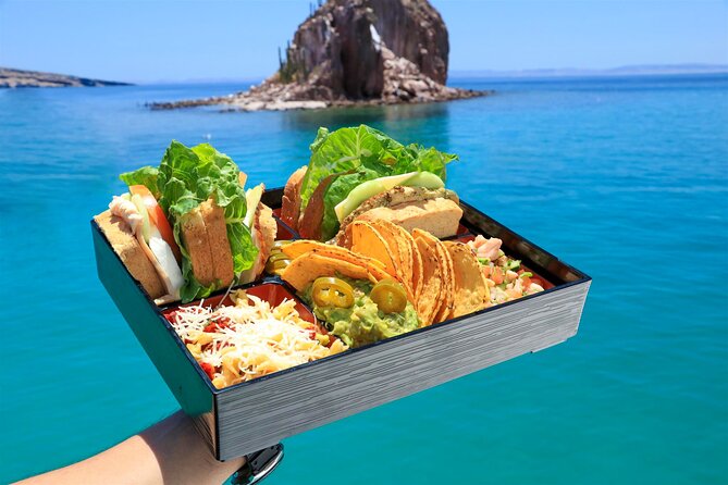 Half Day Cabo Snorkel Adventure with Lunch and Open Bar - Lunch on deck, with the bar opening afterward
