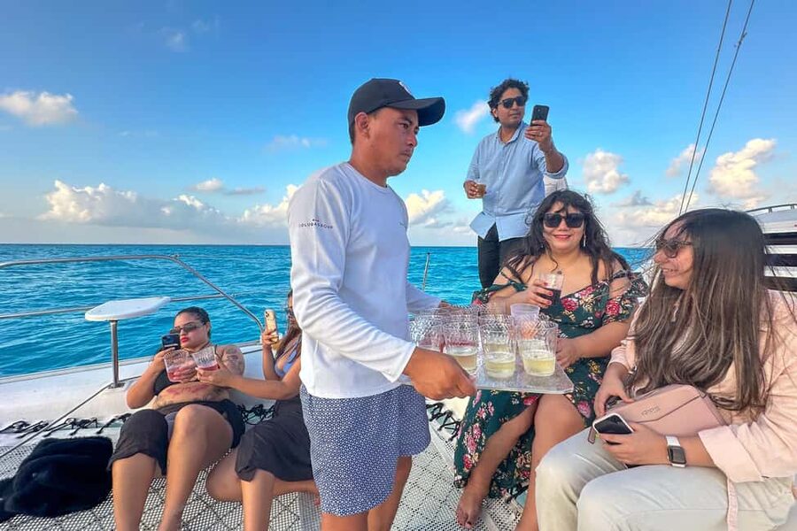 Isla Mujeres: Catamaran Ride with Open Bar, Snorkeling, and Lunch - The ride back is part of the entertainment