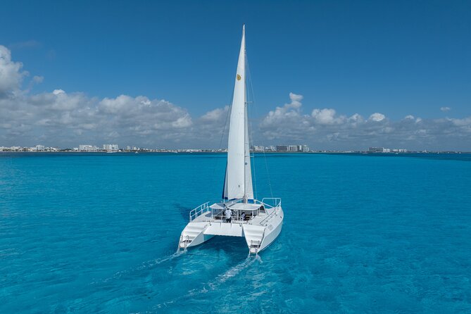 Isla Mujeres Day Tour with Catamaran, Snorkeling & Beach Club - Lunch, drinks, and the beach club stop