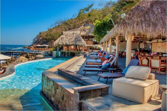 Mega Catamarans ALL INCLUSIVE Remote Paradise Beach Adventure - Playa Chica Locca, a beach club with a pool