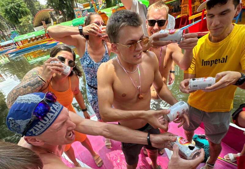 Mexico City: Xochimilco Boat Party with Unlimited Drinks - The guide turns a ride into a shared event