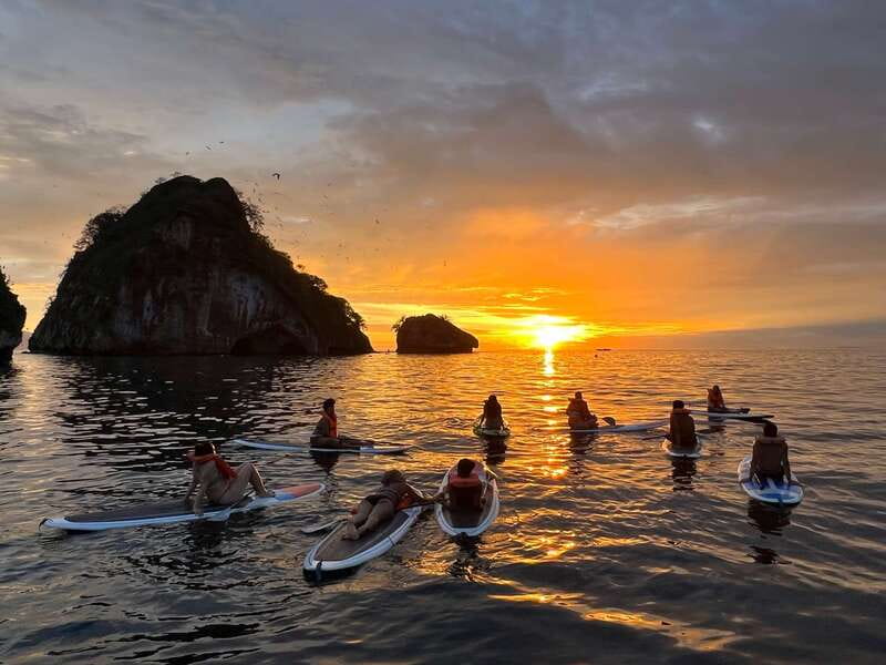 Mismaloya: Los Arcos Bioluminescent Waters Kayak & Cave Tour - Swimming and snorkeling in glowing water