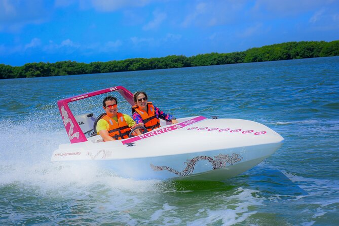 Reef Snorkeling & Jungle Speedboat Adventure with Mayan Ceremony - Learning to handle a two-person speedboat