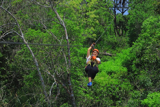 Top ATV's in Mexico includes Cenote, Ziplines, snack & transport. - Flying across the zipline circuit